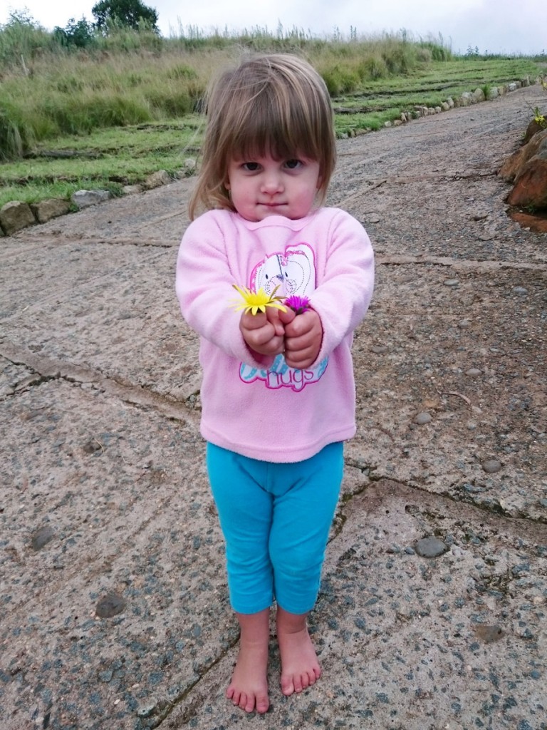 Emma picking flowers at the Bend