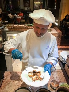 A chef preparing me pani puri