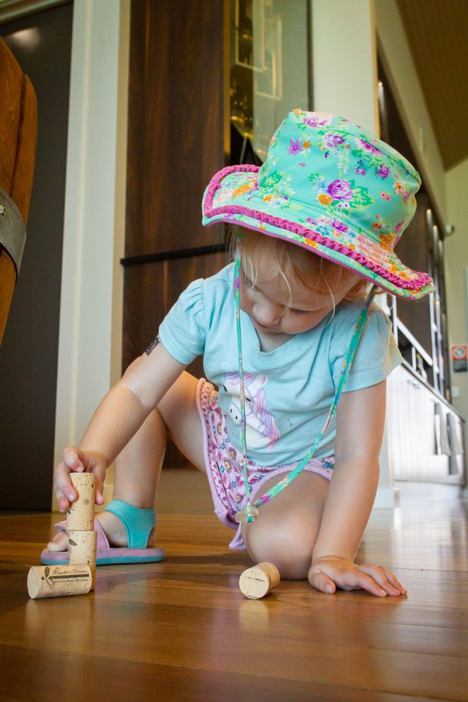 Katie playing with corks