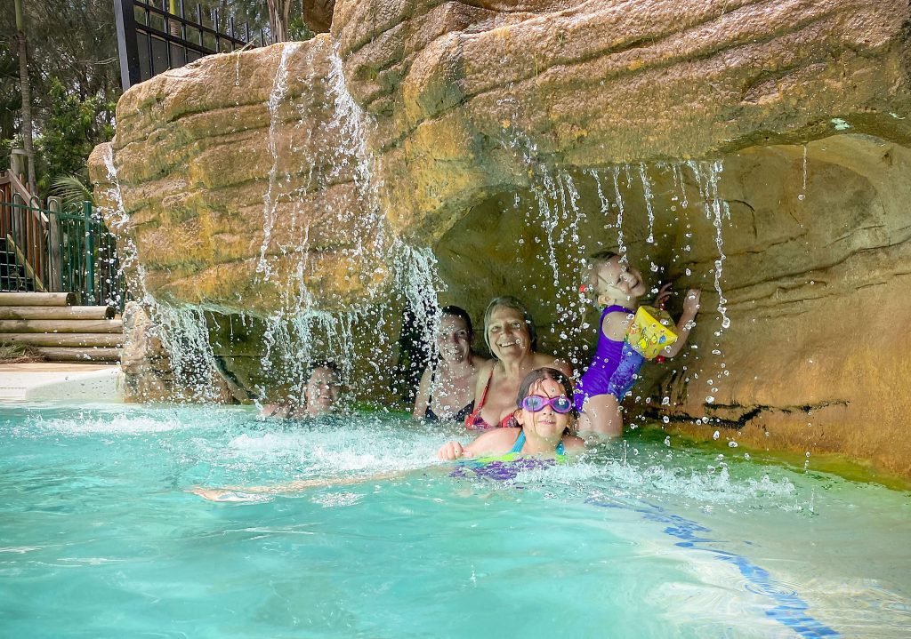 Fun under the waterfall