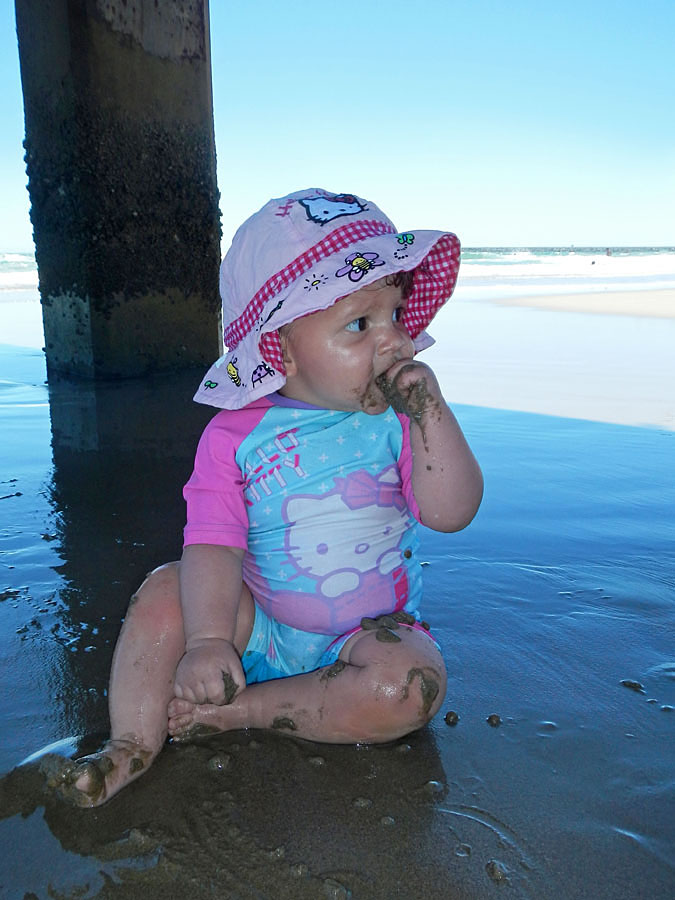 Emma enjoying some sand