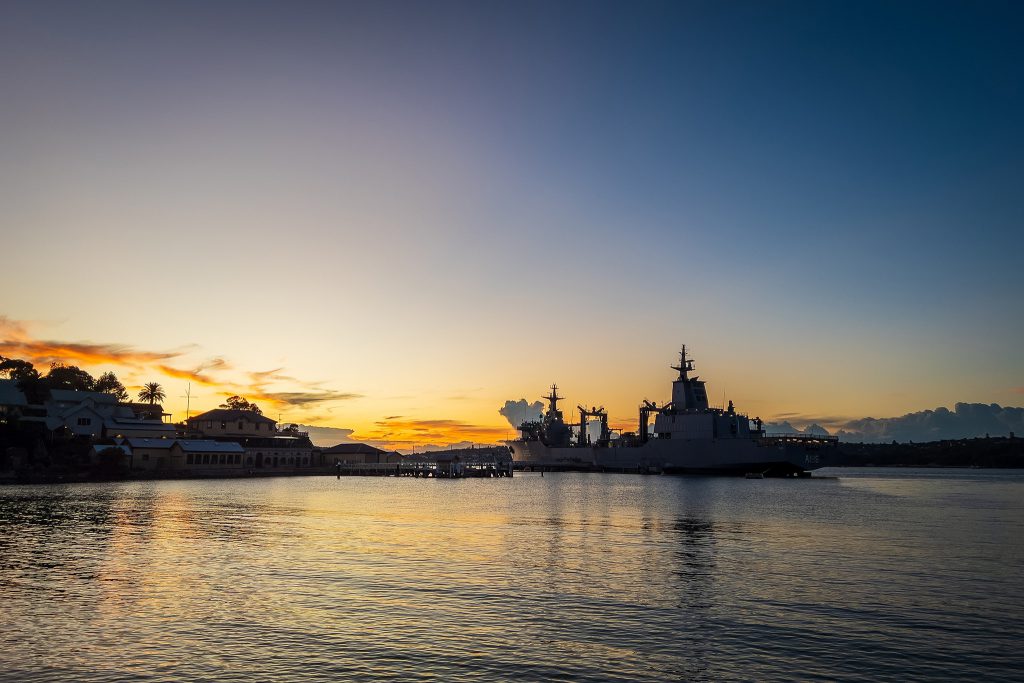 A military ship silhouetted by a glorious Clifton Gardens sunrise